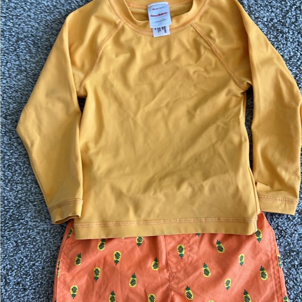 Hanna Andersson swim shirt and Cat & Jack Swim shorts